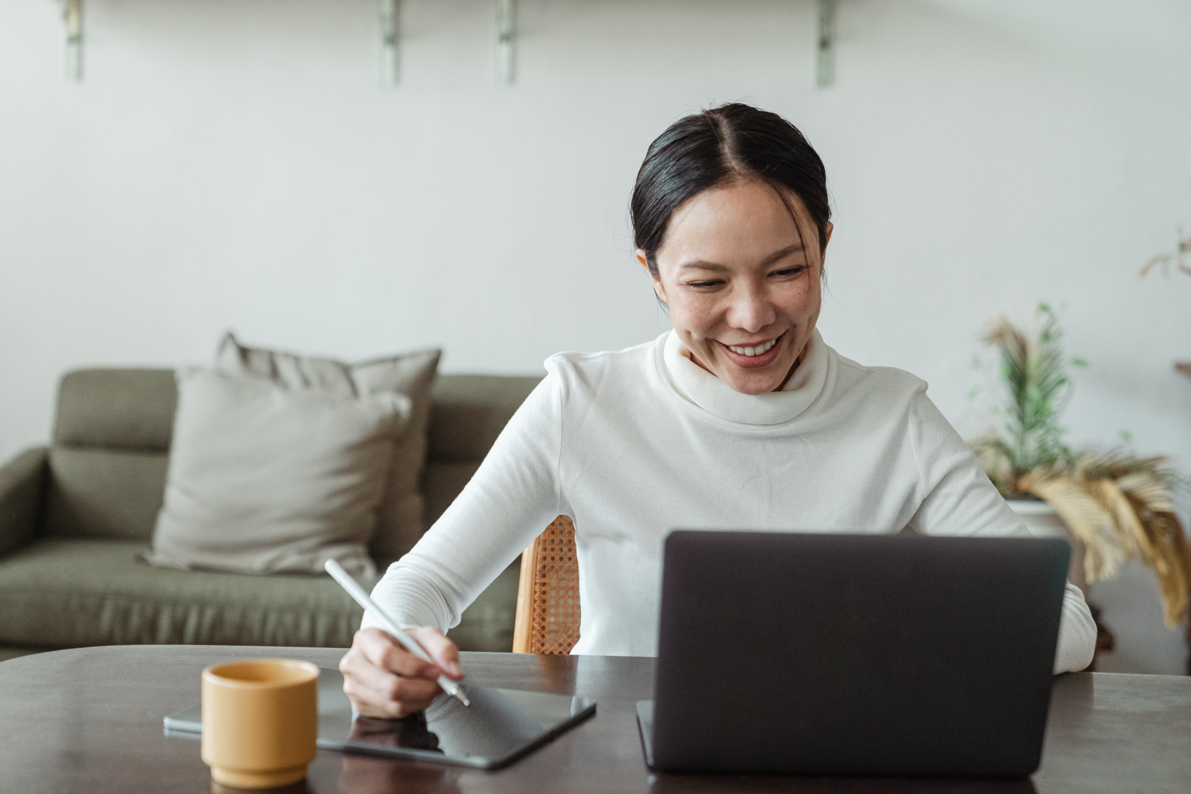Woman with laptop on a desk