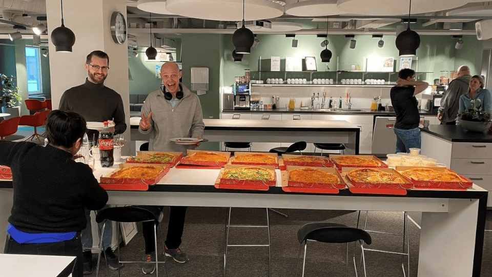 People eating pizza for lunch