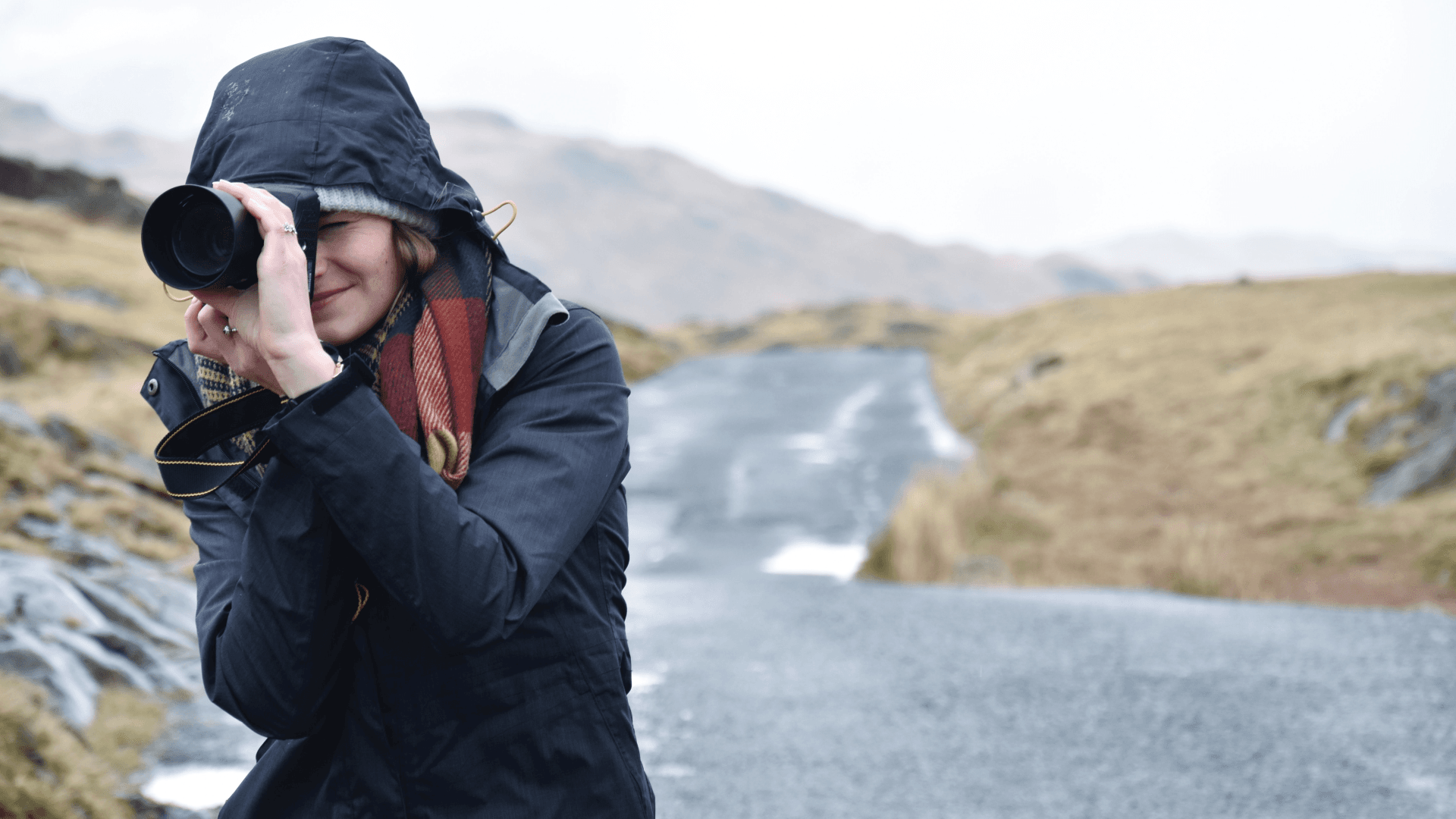 Person taking a picture with a camera outdoor
