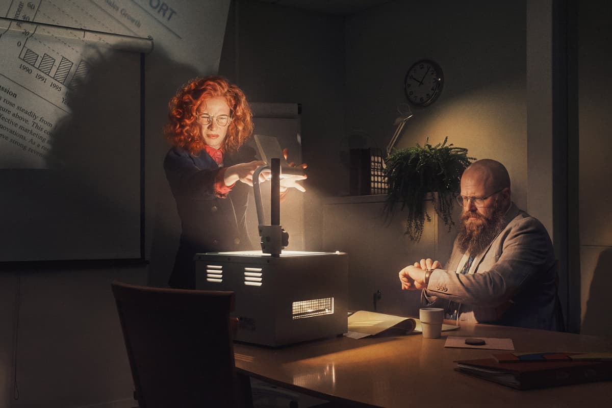 Woman with OH device and man checking his watch